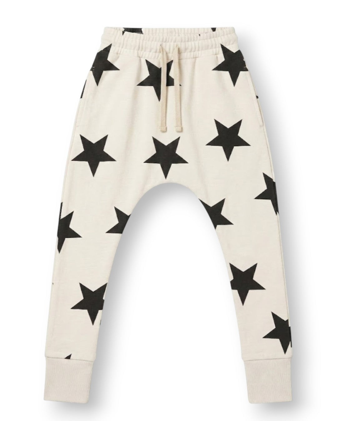 Off-white jogger pants for kids with an all-over black star print, featuring an elastic waistband with a drawstring and ribbed ankle cuffs, shown against a plain white background.